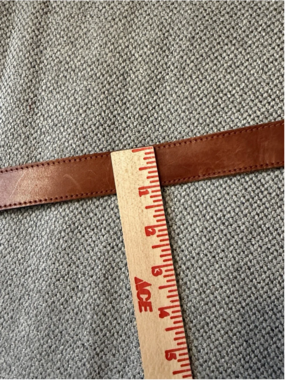 Calderon tan leather belt features a western-style engraved silver buckle